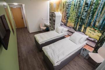 Фото номера Двухместный номер с 1 кроватью или 2 отдельными кроватями Отель Hotelli Uninen Loviisa г. Ловийса 9